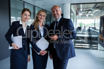 Happy businesspeople smiling at the office