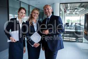 Happy businesspeople smiling at the office