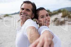 Portrait of romantic couple enjoying on beach