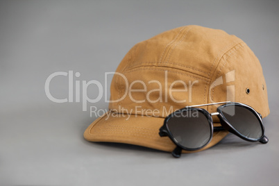 Brown cap with sunglasses