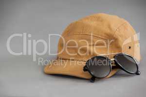 Brown cap with sunglasses