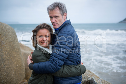 Couple embracing each other at beach Couple embracing each other at beach