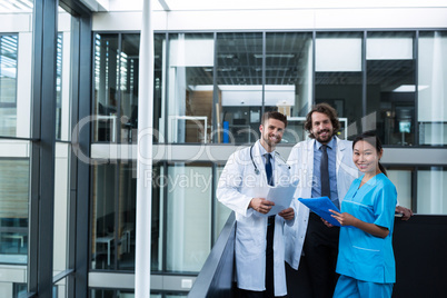 Doctors and nurse holding medical reports