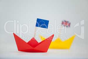 Red paper boat with european union flag