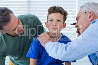 Doctor examining the ear of patient