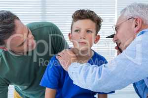 Doctor examining the ear of patient