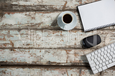 Coffee cup, notepad with mouse and keyboard