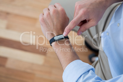 Man hand using a fitness band