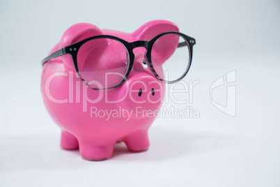 Close-up of piggy bank with spectacles