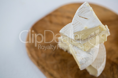 Brie cheese on wooden board