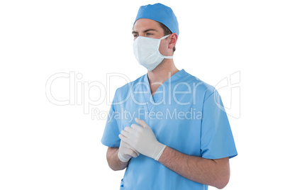 Surgeons hand wearing surgical gloves and holding