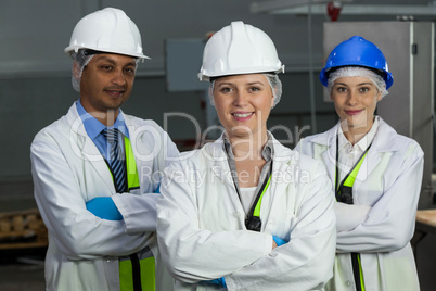 Team of technicians standing with arms crossed