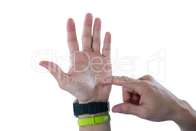 Man hand wearing watch and fitness band