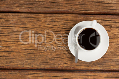 Cup of coffee on wooden table