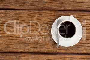 Cup of coffee on wooden table