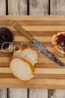 Bread with jam and knife