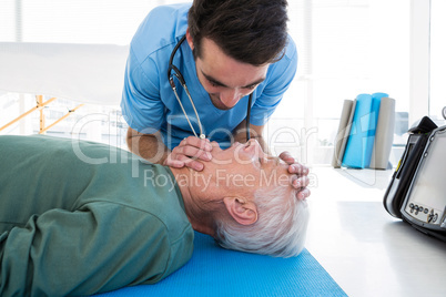 Doctor performing resuscitation on patient