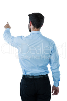 Businessman pretending to touch an invisible screen