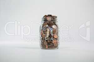 Glass jar full of coins
