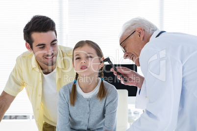 Doctor examining the ear of patient