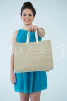 Beautiful woman holding shopping bag