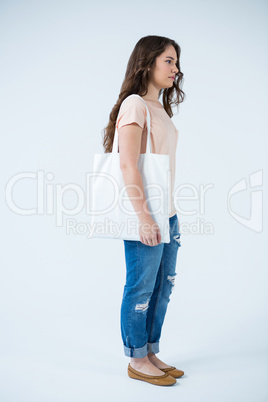 Beautiful woman carrying shopping bag