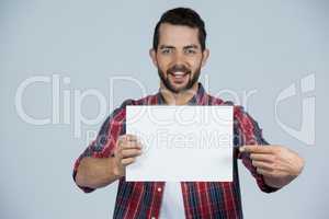 Man holding a blank placard