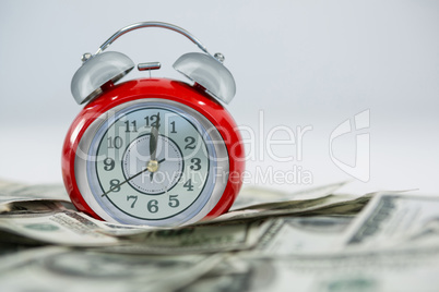 Alarm clock with dollars