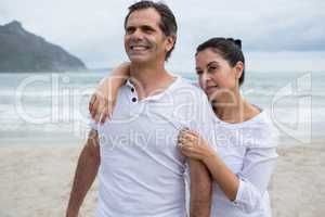 Romantic couple standing on beach