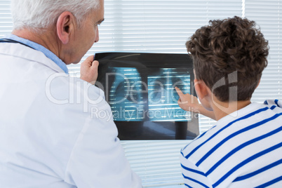 Doctor discussing x-ray report with patient