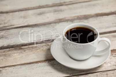 Cup of coffee on wooden table