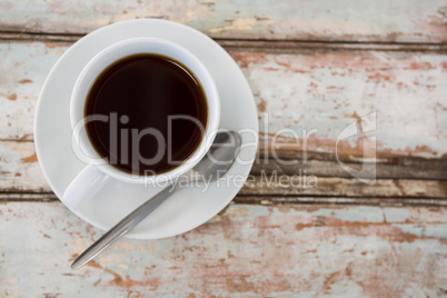 Cup of coffee on wooden table