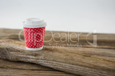 Disposable coffee cup with polka dots