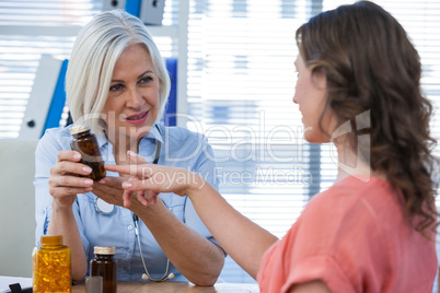 Doctor explaining medicine to her patient