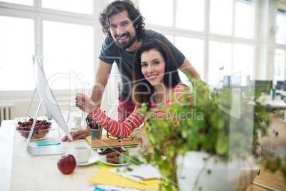 Graphic designers working over computer