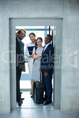 Businesspeople standing in elevator