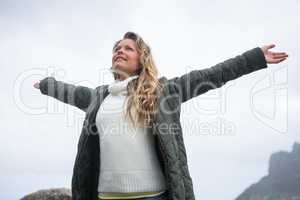 Happy woman with arms wide open