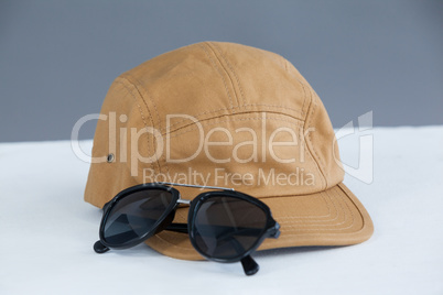 Brown cap with sunglasses