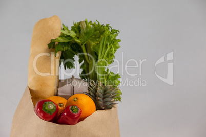 Fruits and vegetables in brown grocery bag