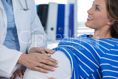 Doctor examining pregnant woman