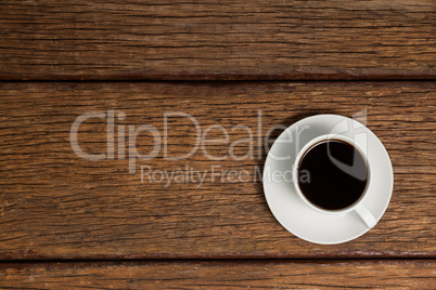 Cup of coffee on wooden table