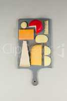 Variety of cheese on chopping board