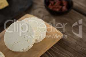 Feta cheese on wooden board