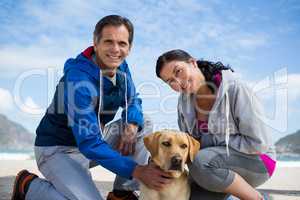 Portrait of couple with their pet dog