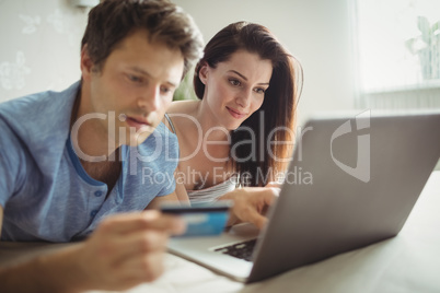 Happy couple shopping online