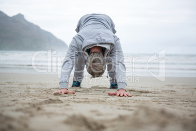 Man push-up on beach