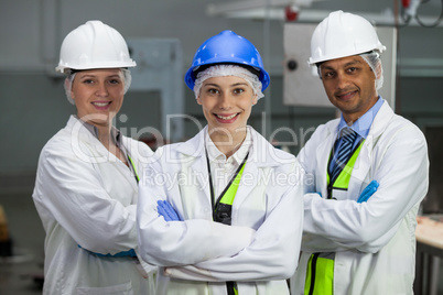 Team of technicians standing with arms crossed