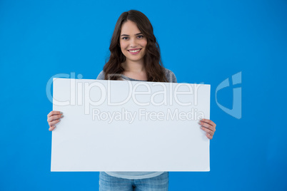 Woman holding a blank placard