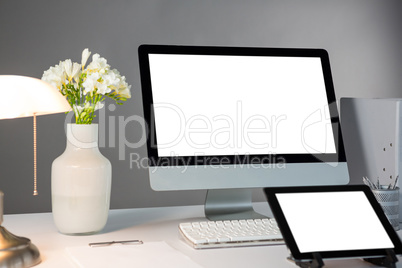 Desktop pc with digital tablet on table