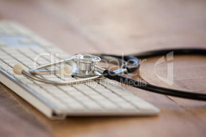Close-up of keyboard with stethoscope
